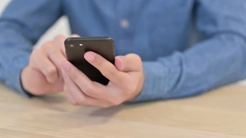 Male Hands Using Smartphone Close Up