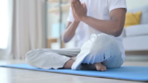 Close Up of Legs of African Man Doing Yoga at Home