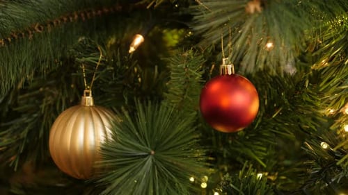 Luxurious Christmas tree ornaments close-up 4K 2160p 30fps UltraHD footage - Gold and red baubles wi