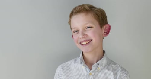 Close-up Portrait. The Boy Is Smiling at the Camera.