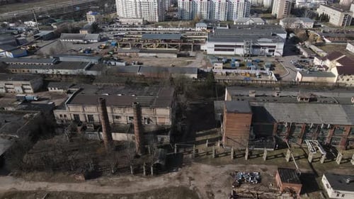 Abandoned Industrial Area. Old Brick Buildings And Factory Chimneys.