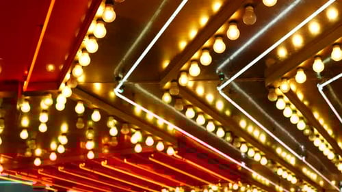 Defocused Old Fasioned Electric Lamps Glowing at Night. Abstract Close Up of Blurred Retro Casino