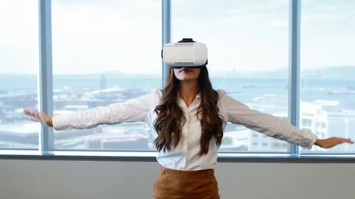 Woman Does Yoga Wearing Virtual Reality Headset