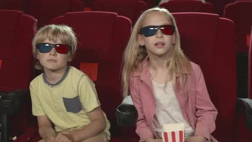 Two Kids Watching 3d Movie in Cinema