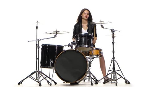 Young Woman Playing Drums in Bright Studio