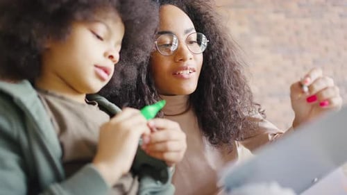 Close Portrait of a Mother and Son Have Fun on the Weekend Together