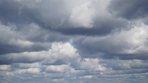 Billowing Storm Clouds Moving Across a Bright Sky