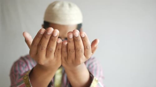 Muslim Man Keep Hand in Praying Gestures During Ramadan Close Up