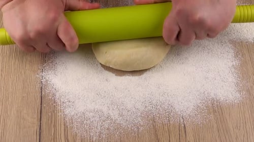 Rolling Dough Flat with Green Rolling Pin