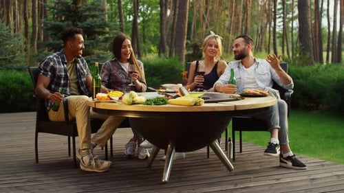 Happy Guys Spending Weekend in Summer Forest