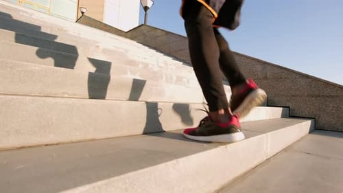 Runner Exercising, Running Up Urban Stone Staircase