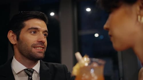 4K Close up of Caucasian woman drinking fancy cocktail at luxury bar.