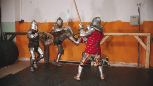 Medieval Armored Warriors Training with Swords and Axes