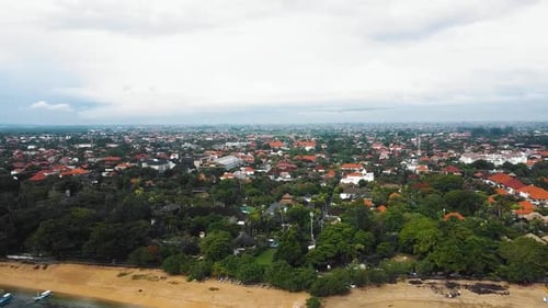 Beautiful cinematic Sanur beach, Bali drone footage with interesting landscape, fishing boats, villa