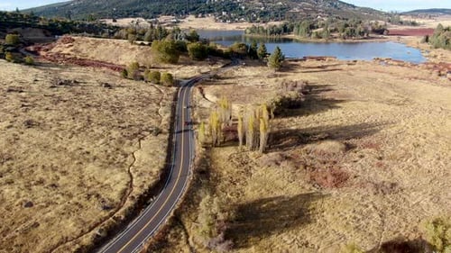 Aerial View of Small Road with Car Next the Lake Cuyamaca, California, USA