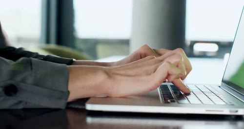 Close Up of Hands Typing on Laptop Keyboard