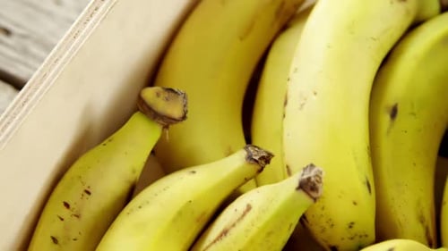 Close Up of Ripe Bananas in Wooden Crate