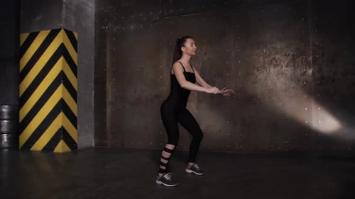 Occupation in the Gym Beautiful Sportswoman. Squats and Lunges