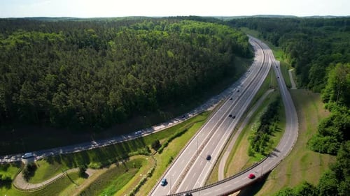 Scenic Aerial View Of Highway With Overpass. Traffic On Rural Roads.