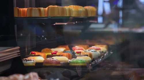 Pastries displayed in bakery glass case