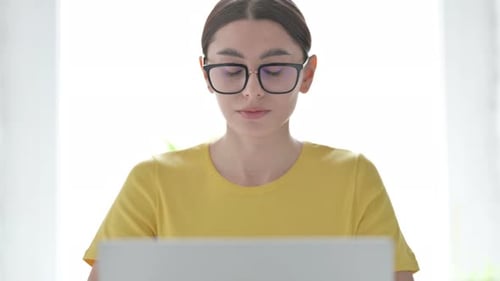 Woman Works On Laptop At Home