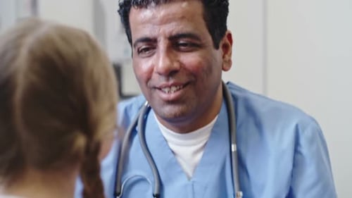 Doctor Examining Young Patient in Hospital Close-Up