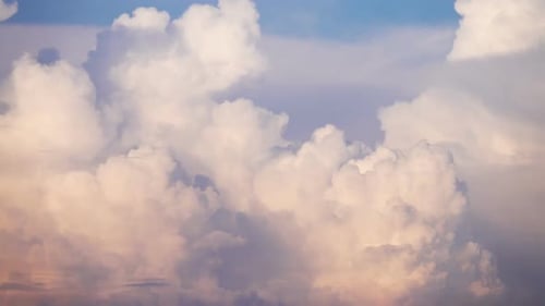 Clouds Drifting in a Pink Sky at Sunset