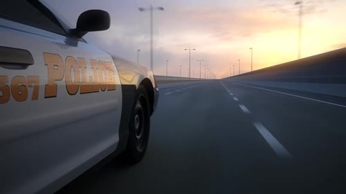 Two police cars chase. The vehicles are involved in the urgent pursuit.
