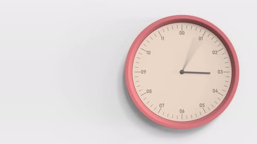 Orange Wanduhr im Büro
