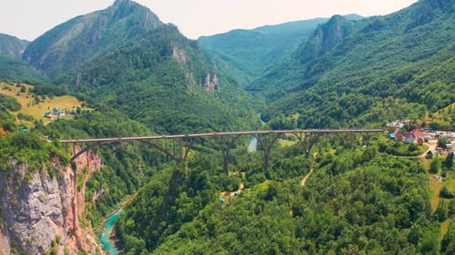 Aerial view on the Djurdjevic Bridge in Montenegro is a concrete arch bridge across the Tara River.
