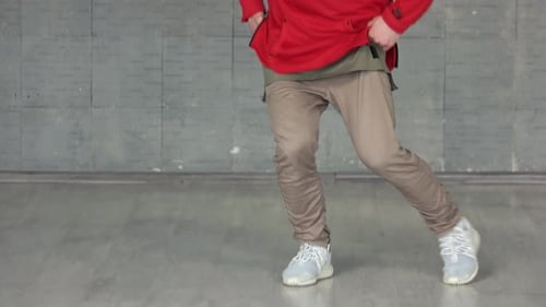Stylish Young Man Dancing in Studio