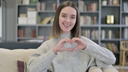 Woman Making a Heart Shape with Hands