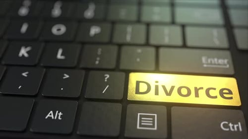 Black Computer Keyboard and Gold Divorce Key