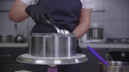 Pastry Chef Preparing Delicious Cake in Kitchen