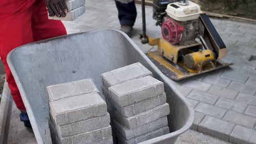 Installing Stone Pavers for a New Sidewalk