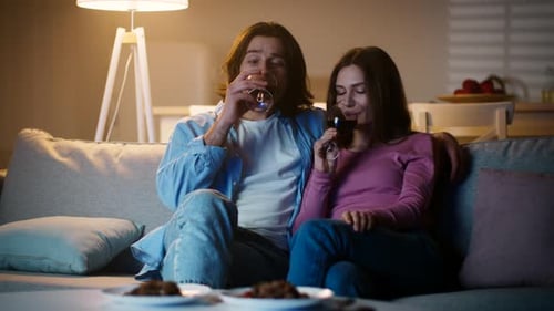 Couple Relaxing at Home With Wine