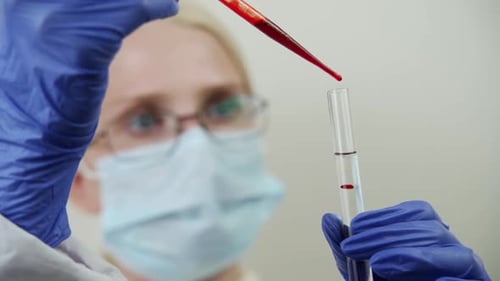 Blood Sample Being Dripped Into Test Tube