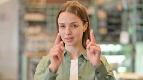 Portrait of Beautiful Woman with Pointing and Inviting