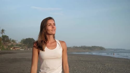Happy Woman Walking on Ocean Beach and Enjoying View