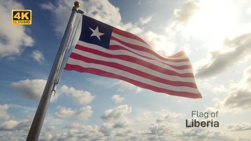 Liberian Flag Waving on Flagpole Against Sunny Cloudy Sky