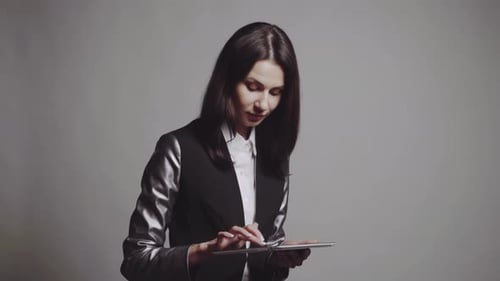 Woman Uses Tablet in Studio