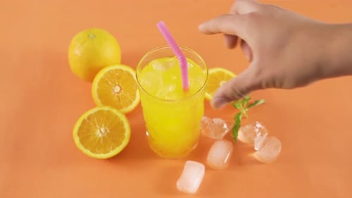 Fresh Orange Juice with Ice and Straw