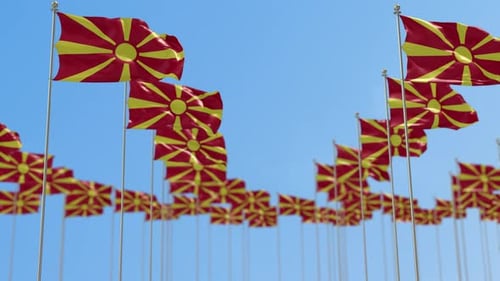 North Macedonia Flags Waving in Wind Against Blue Sky