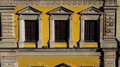 Facade of a European city building. Elements of architecture. Aerial drone view.