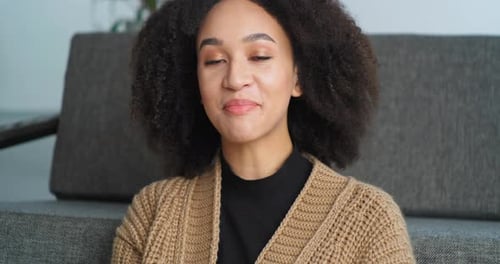 View From Webcam Afro American Woman Speaks in Camera Answers Video Call Sits at Home in Living Room