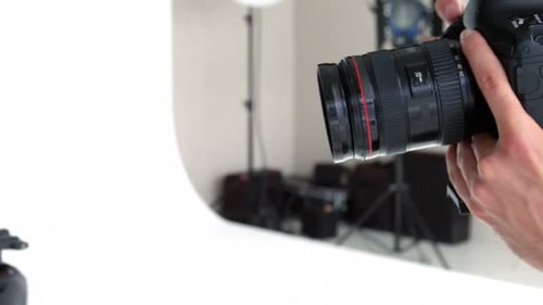 Close Up of Camera and Hand Adjusting Settings