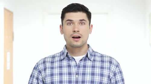Man Reacting With Surprise and Excitement