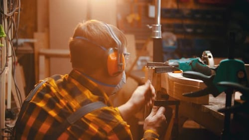 Man Works in a Woodworking Shop