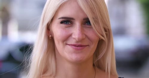 Smiling Blonde Woman Portrait in Urban Setting