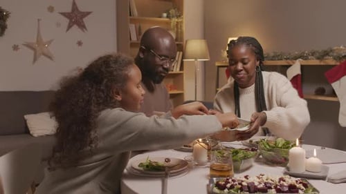 Family Shares a Meal Together at Home